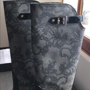 Valentino rain boots with lace and gold detailing.